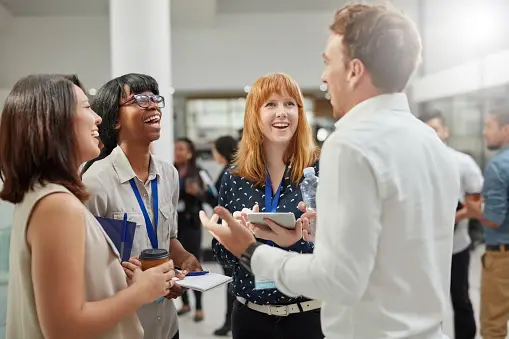 A group of real estate agents talking and networking