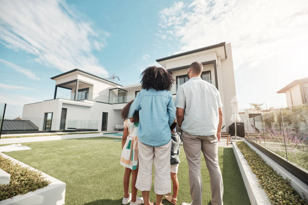 A picture of a family looking at a house for sale