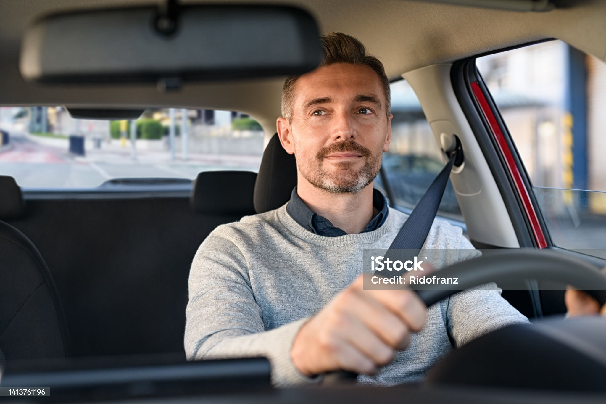 Real estate agent driving a car