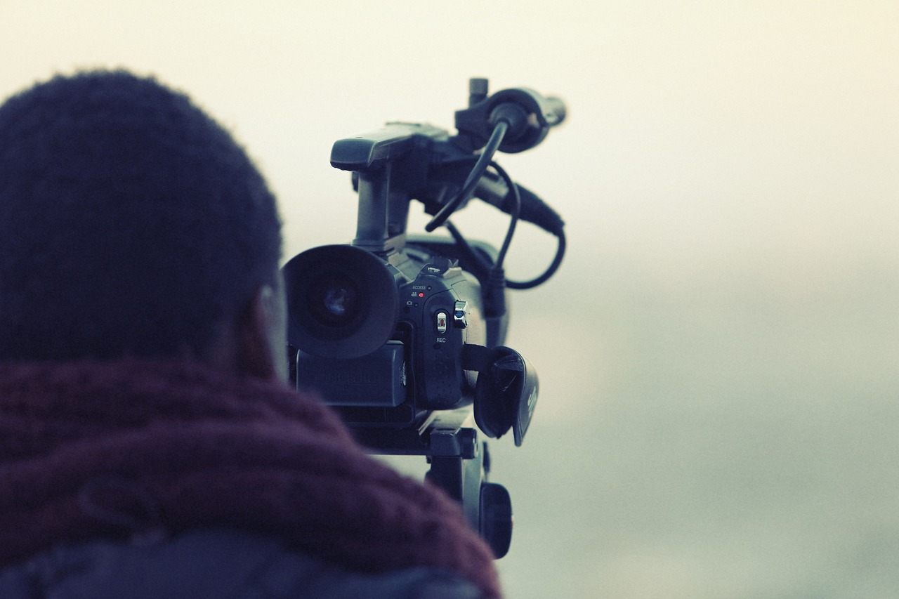 A person setting up a camera to capture a virtual tour of a property