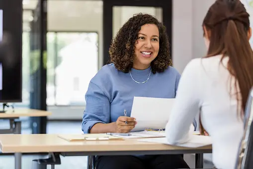 Real estate agent talking to a first-time homebuyer about buying a property