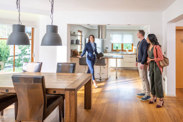 Real estate agent showing a property to a couple